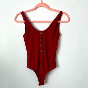 Little red bodysuit never been worn size small Ribbed material